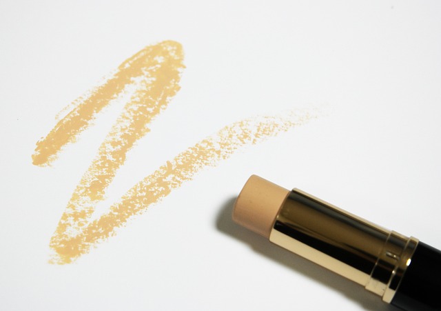 Person testing foundation shades on their jawline in natural light (drugstore foundation)