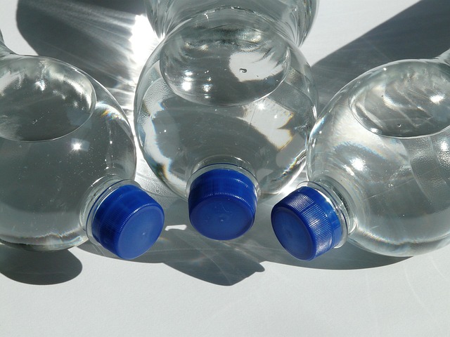 three bottles of blue nail polish in light, medium, and dark shades arranged for a blue ombre gradient