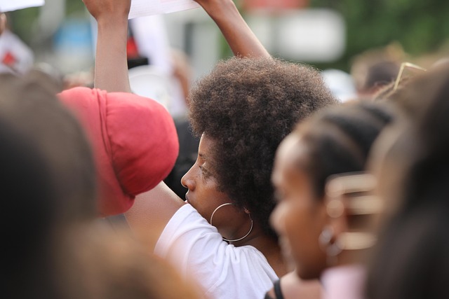 Woman with a voluminous Afro hairstyle from the late 1960s, a symbol of cultural pride